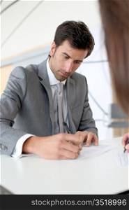 Businessman filling in business contract