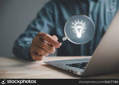 Businessman finds light bulb using magnifying glass. Idea and imagination. Concept of creative innovation. Innovation icon represents network connection. SEO enhances idea optimization.