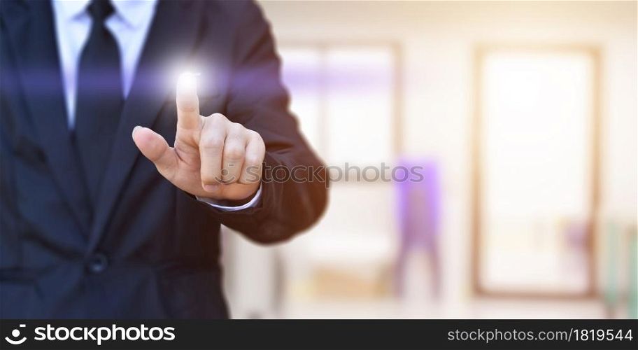 Businessman finger pressing an imaginary screen. Idea for business, technology, internet and networking.