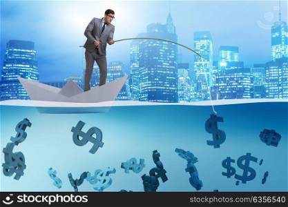 Businessman fishing dollars money from paper boat ship. The businessman fishing dollars money from paper boat ship
