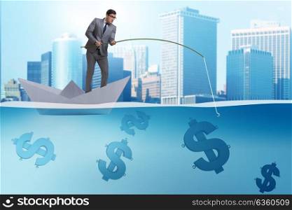 Businessman fishing dollars money from paper boat ship