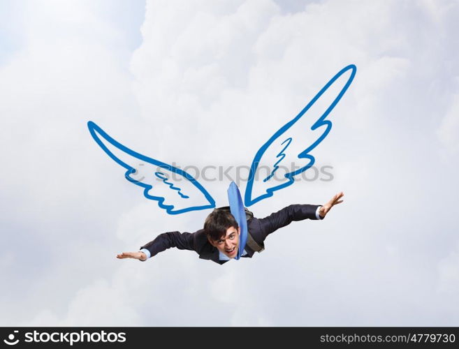 Businessman flying high. Young businessman with drawn wings flying in sky