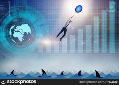 Businessman flying holding balloon