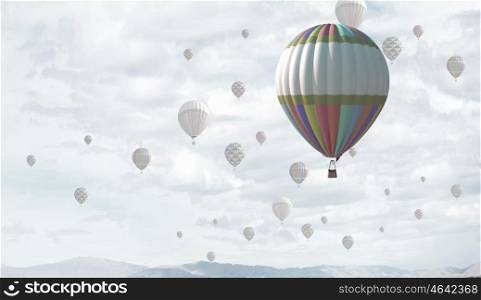 Businessman flying in search of ideas gripping the balloon. Search for new business ideas