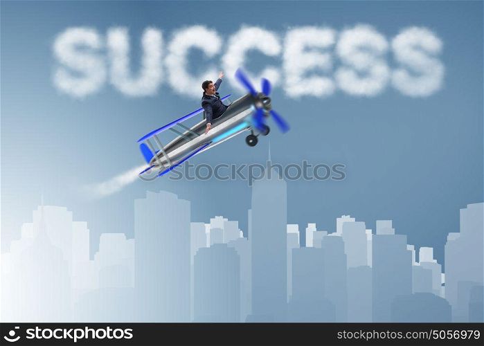 Businessman flying on airplane in success concept