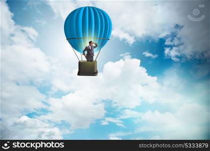 Businessman flying on balloon in challenge concept