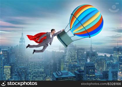 Businessman flying on balloon in challenge concept