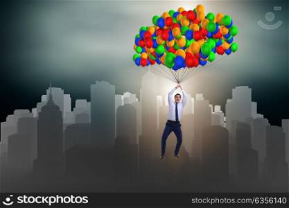 Businessman flying on balloons in challenge concept