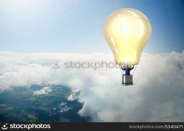 Businessman flying on hot balloon