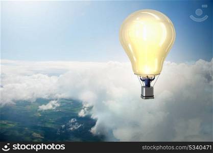 Businessman flying on hot balloon