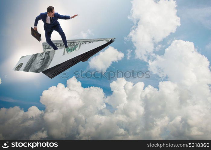 Businessman flying on paper plane in business concept