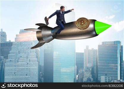 Businessman flying on rocket in bitcoin price rising concept