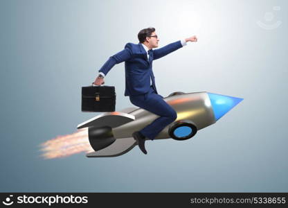 Businessman flying on rocket in business concept