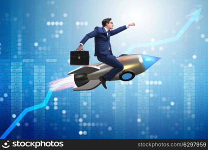 Businessman flying on rocket in business concept