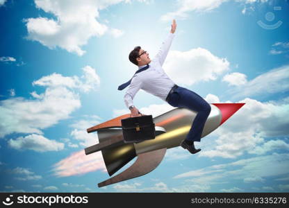 Businessman flying on rocket in business concept