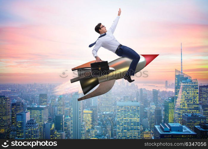 Businessman flying on rocket in business concept