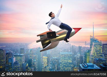 Businessman flying on rocket in business concept