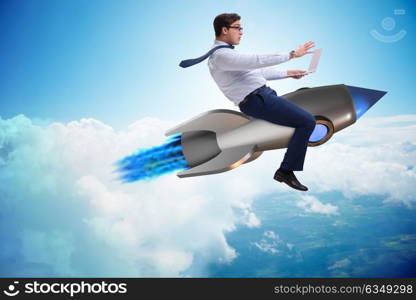 Businessman flying on rocket in business concept