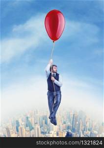 Businessman flying on the big ballon above the city. Businessman flying on the big ballon