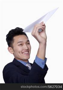 Businessman Flying Paper Airplane