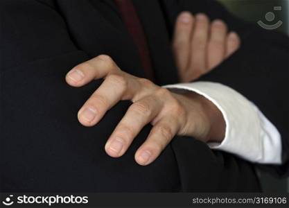 Businessman folding hands