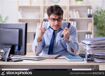 Businessman frustrated at many telephone calls