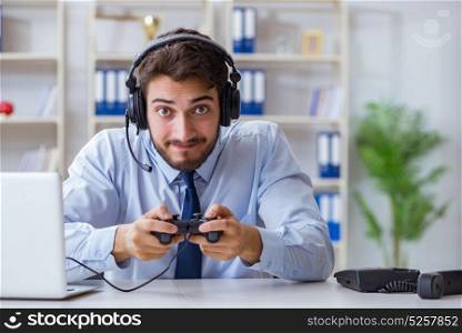 Businessman gamer in office playing games