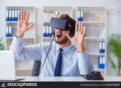 Businessman gamer in office playing games