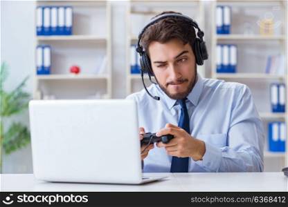 Businessman gamer in office playing games