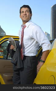 Businessman getting out of taxi