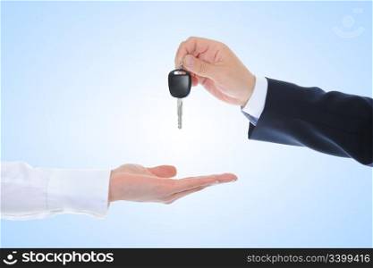 Businessman gives the keys to the car.