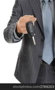 Businessman gives the keys to the car. Isolated on white