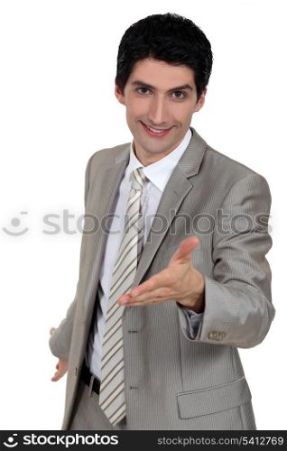 Businessman giving his hand