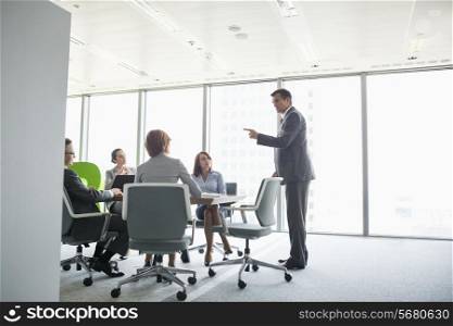 Businessman giving presentation in conference room