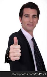 Businessman giving the thumb&acute;s up