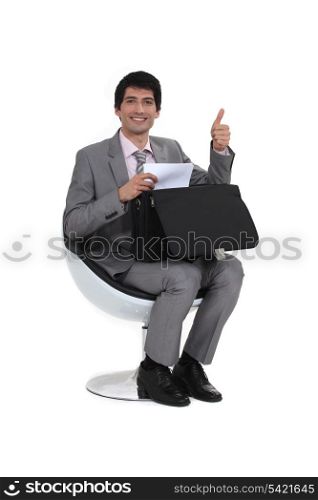 Businessman giving the thumb&rsquo;s up