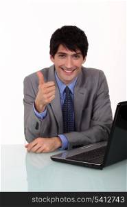 Businessman giving the thumbs up