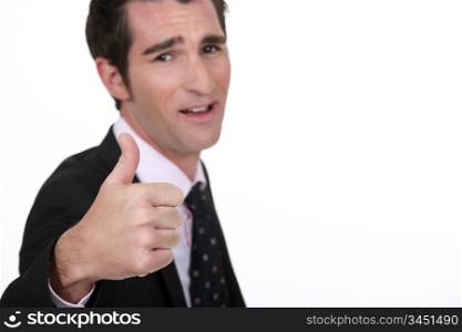 Businessman giving thumbs-up