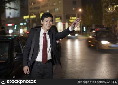 Businessman Hailing Taxi Cab
