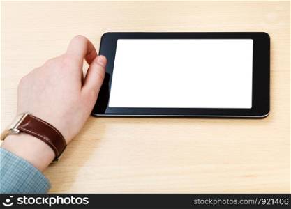 businessman hand and tablet PC with cut out screen at office table