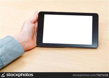 businessman hand and tablet PC with isolated screen at office desk