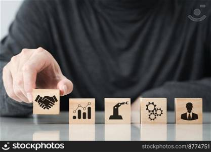 Businessman hand arranging wood block with agreement Ideas partnership symbol, Planning for goals against business success , Business cooperation , Icon shaking hands