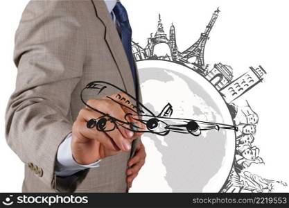 businessman hand draws dream travel around the world