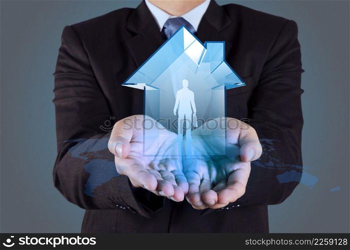 businessman hand holding 3d house with human icon as insurance concept