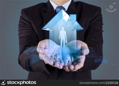 businessman hand holding 3d house with human icon as insurance concept