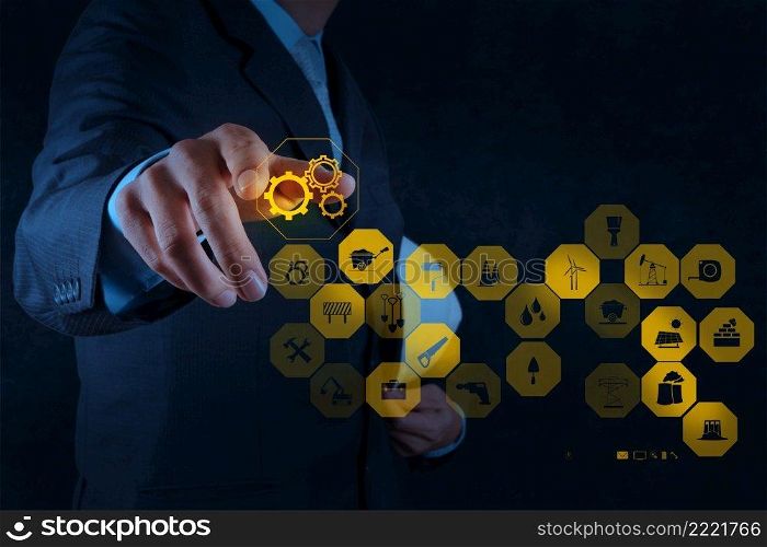 businessman hand point the gears icon to success concept