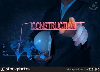 businessman hand pointing to construction as concept