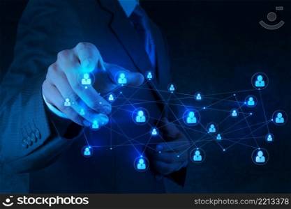businessman hand pointing to social network as concept