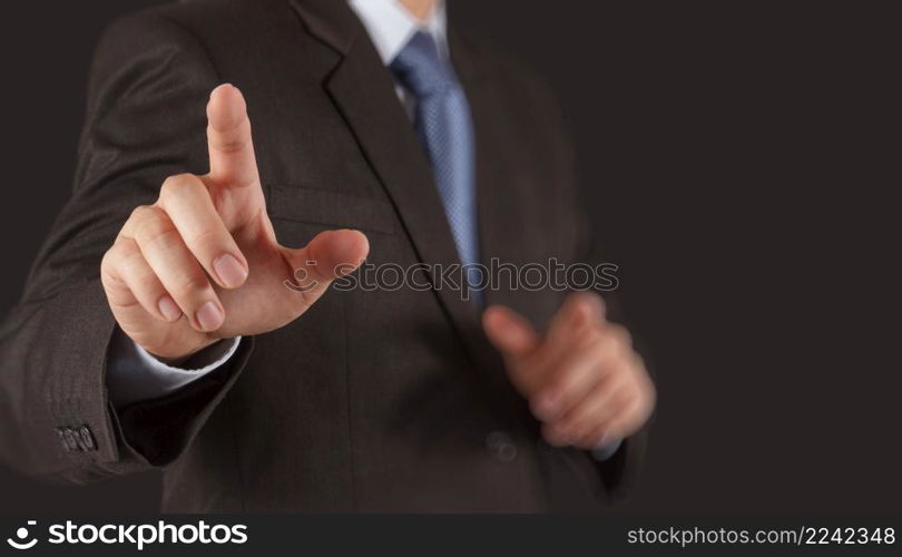 Businessman hand pressing an imaginary button on virtual screen