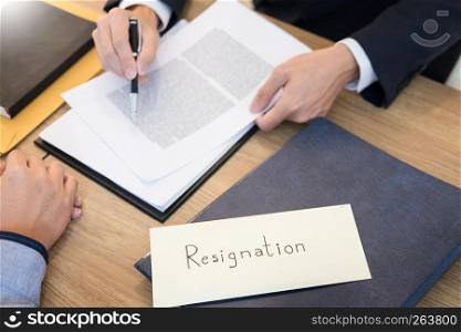 businessman hand sending a resignation letter to executive boss dismissed worker quit out from company, Change job, unemployment, resign concept.